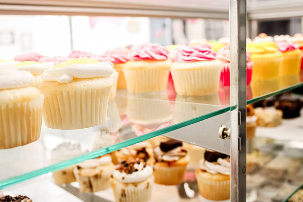 Delicious cupcakes in a display case at Sugar Mama's Bake Shoppe - Belleville, ON